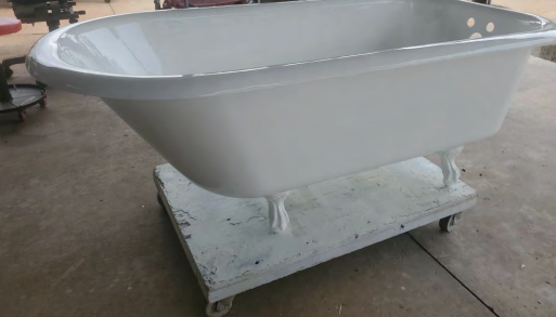 A white bathtub placed on a cart, showcasing a portable and stylish design for bathroom use. Bathroom renovation project in Buda, TX.
